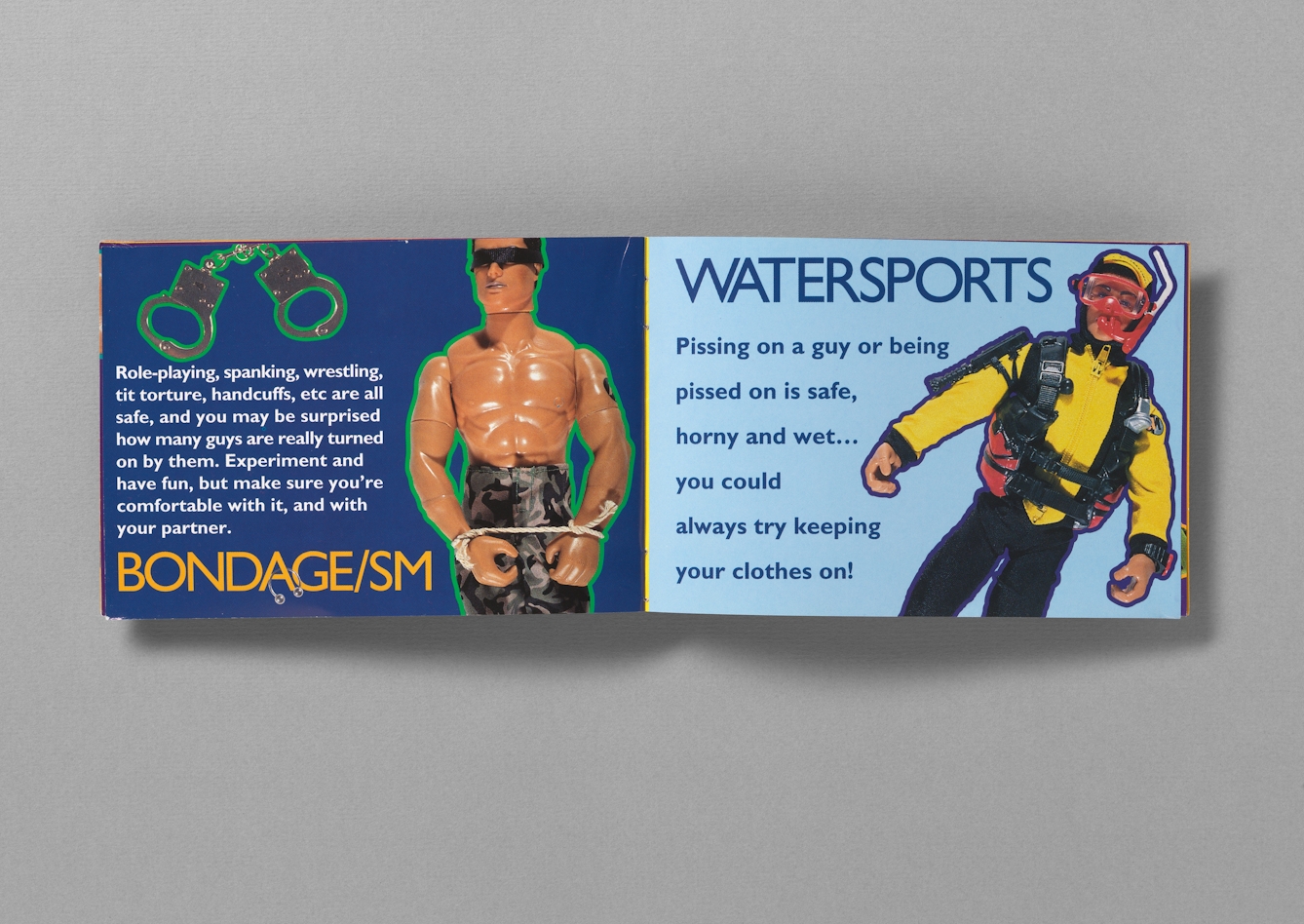Colour photograph of the inside of a booklet called "Get ready for Action: a gay man's guide to safer sex". The pages photographed show Action Man toys, one with a blindfold and rope around wrists, to represent bondage, and another in snorkeling gear, to represent sexual watersports. 