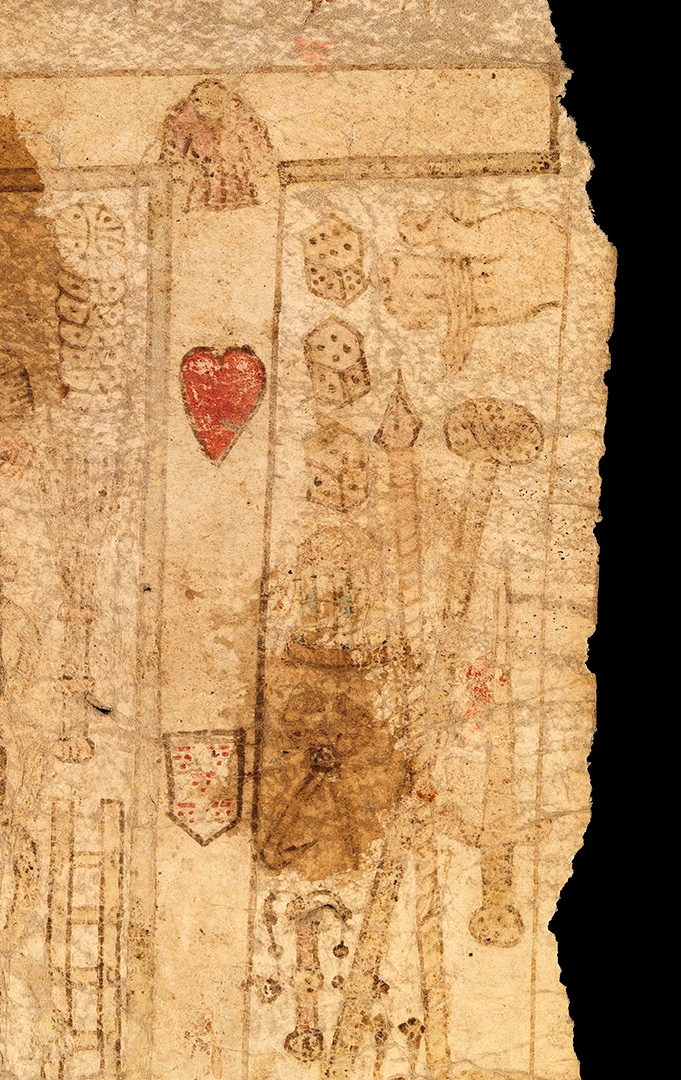 A stained and damages section of a 15th century birth scroll, showing the Arma Christi ("weapons of Christ"), or the Instruments of the Passion, including the cross, spear, dagger, ladder,nails.