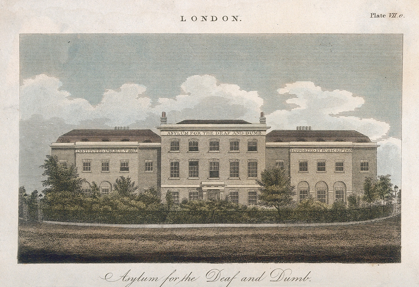 Coloured engraving of a large 19th century stone building with a three storey central section, flanked by a 2 storey wing on either side.Lettering on the front of the building, immediately below the roof says: "Instituted 1792, built 1807. Asylum for the Deaf and Dumb. Supported by subscription." In front of the building is a garden of small trees and schrubs, encircled by iron railings.
