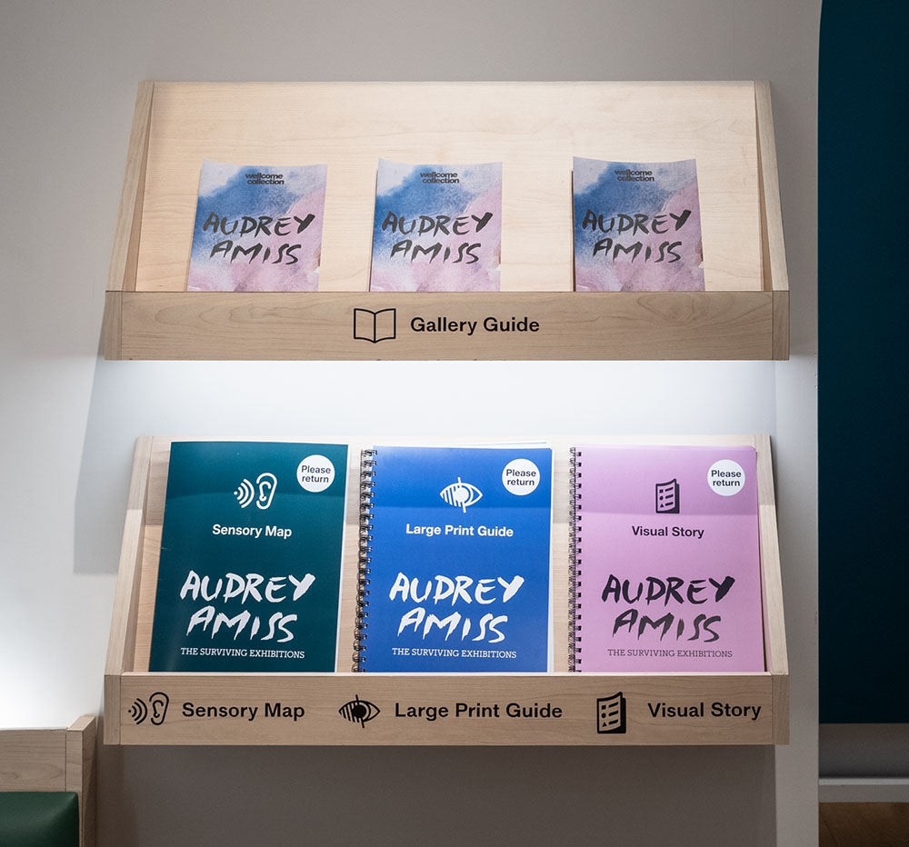 A display of access guides for the exhibition 'Audrey Amiss: the surviving exhibitions' at Wellcome Collection.